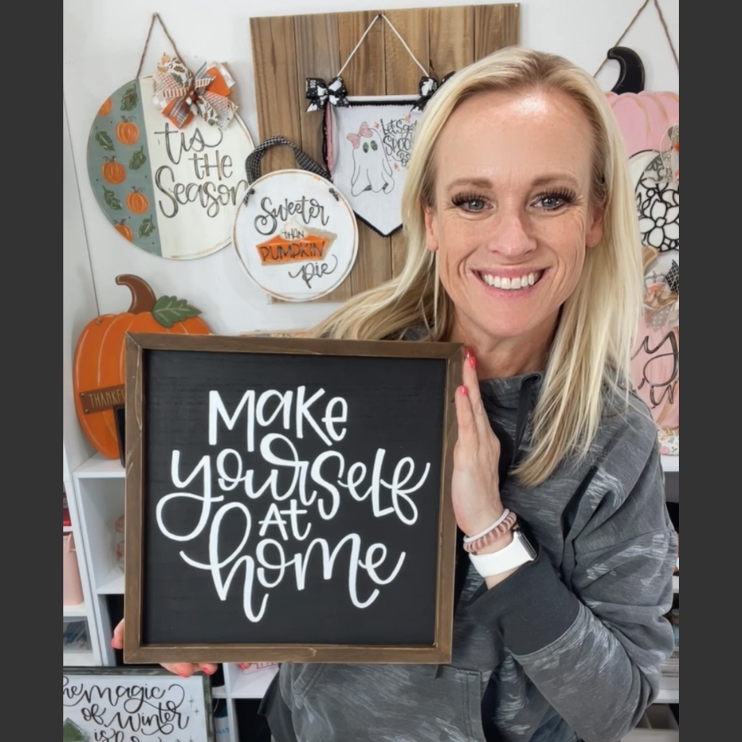 "Make yourself at home" hand lettered chalkboard sign