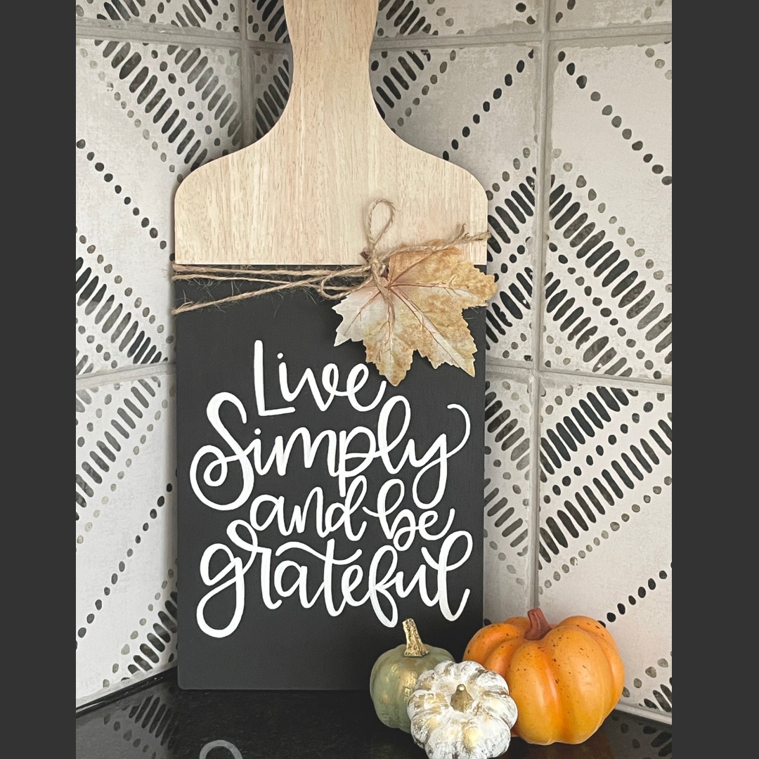 Live simply and be grateful hand lettered sign