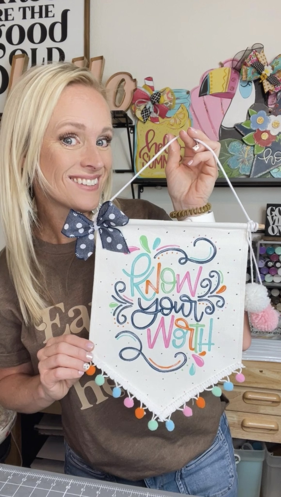colorful hand lettering on canvas banner that reads "know your worth"
